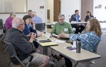 Members of the the Citizen-Business Working Group discuss long-term planning